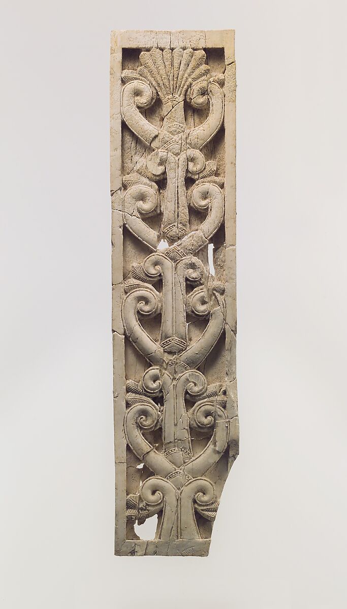 Furniture plaque carved in relief with volutes and a palmette, Ivory, Assyrian