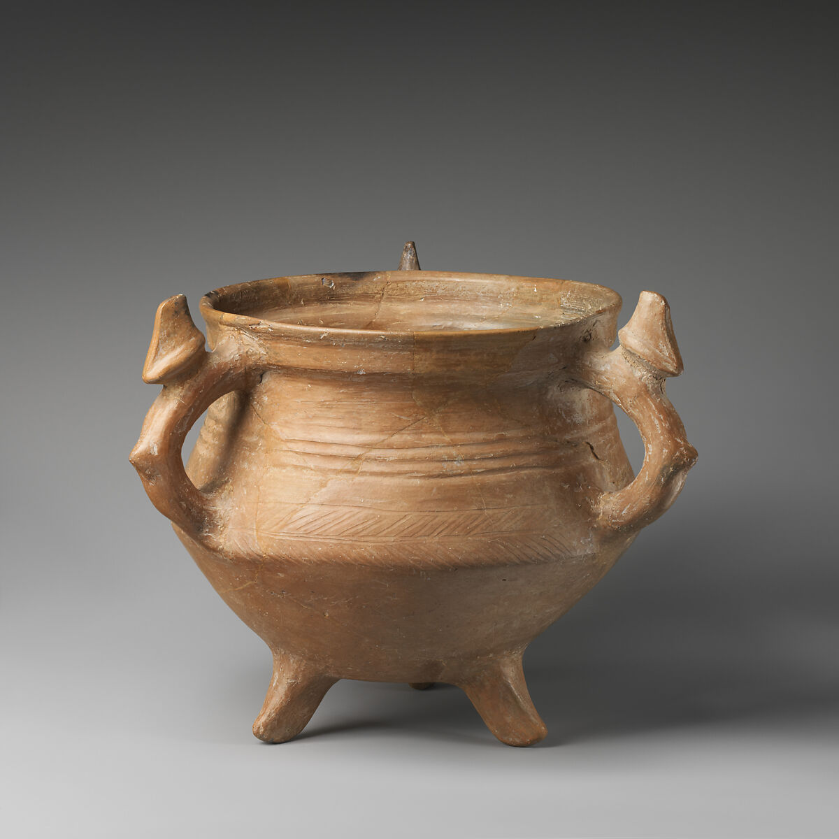 Tripod vessel with three animal-shaped handles, Ceramic, Iran 