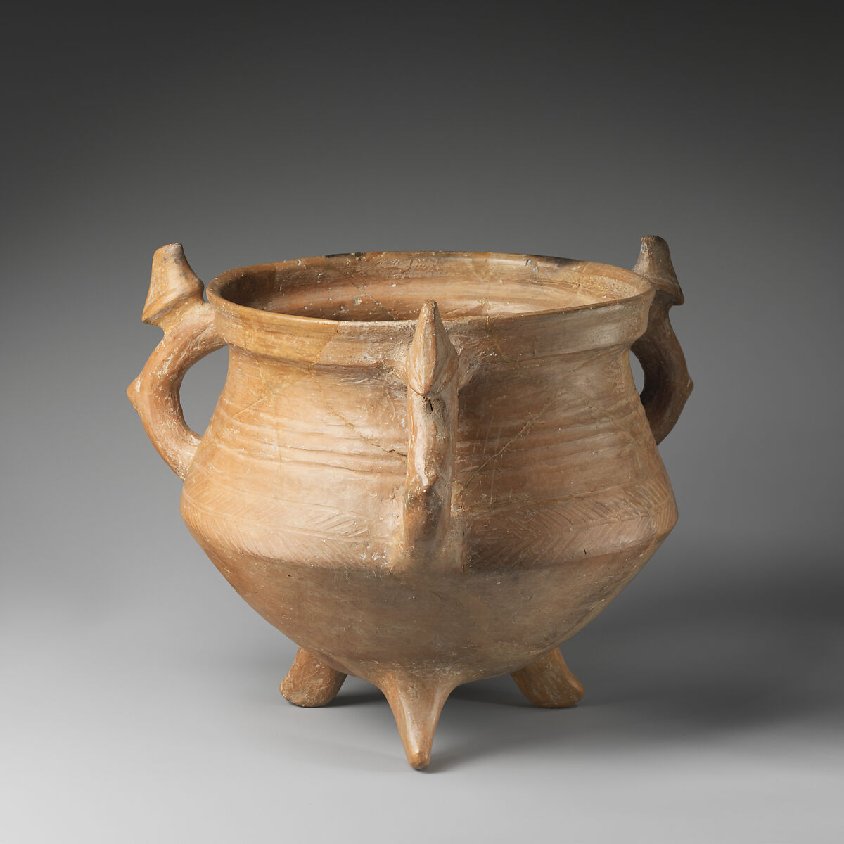 Tripod vessel with three animal-shaped handles, Ceramic, Iran