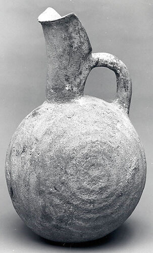 Spouted jug with raised concentric circles