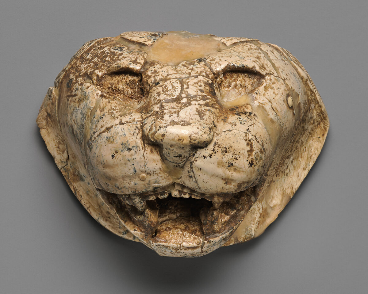Lion's head carved in the round, Ivory, Assyrian 