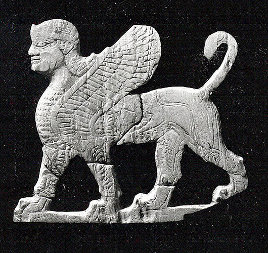 Plaque with a striding sphinx