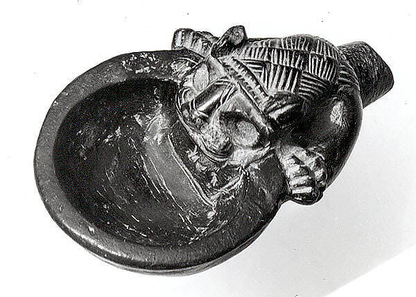 Bowl with a handle in the form of the forepart of a lion