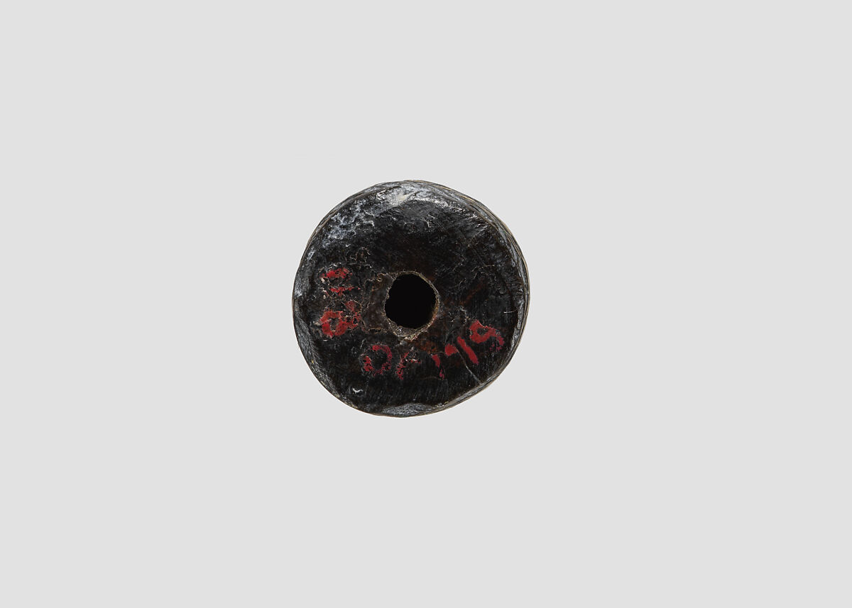 Cylinder seal (with pin preserved) with animal-monster contest scene, Black Steatite, with copper/bronze pin, Assyrian