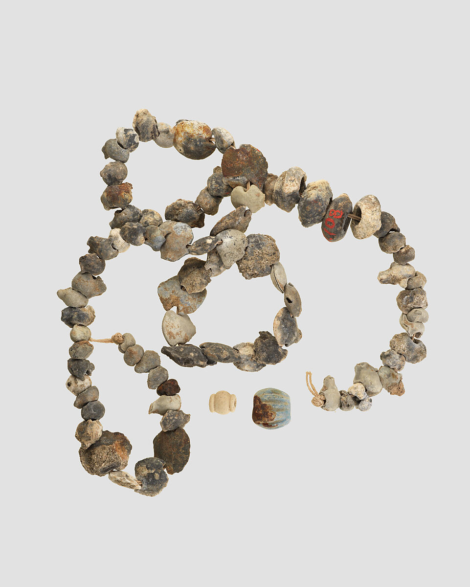 Beads, Antimony (?), shell, string, Iran 