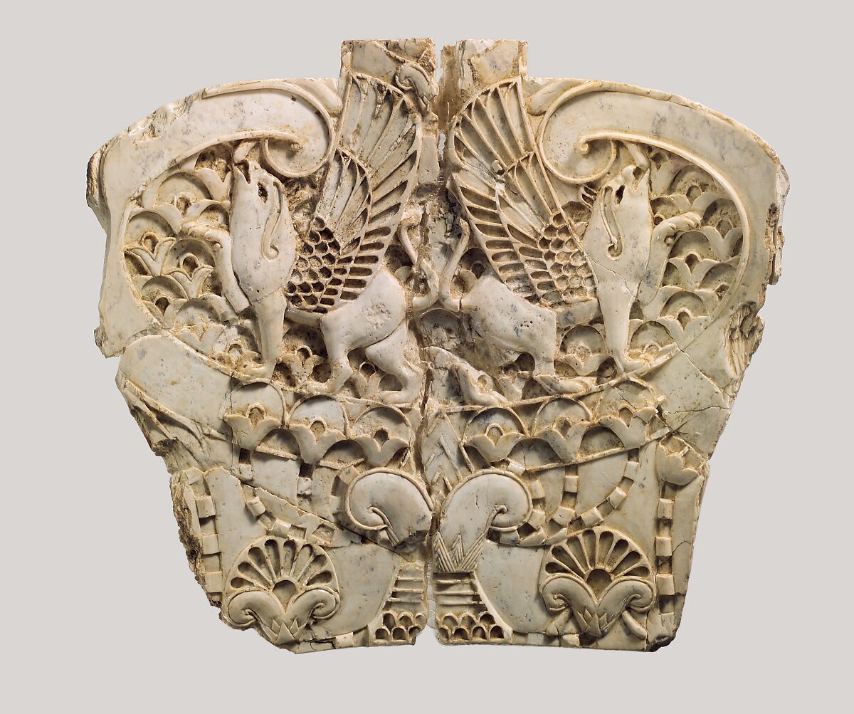 Cloisonné furniture plaque with two griffins in a floral landscape, Ivory, Assyrian 