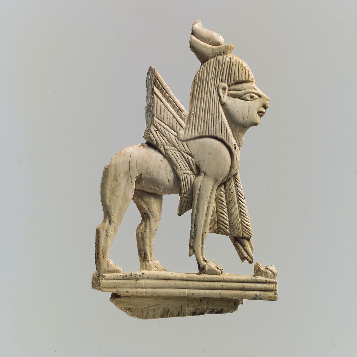 Openwork furniture plaque with winged sphinx, Ivory, Assyrian 
