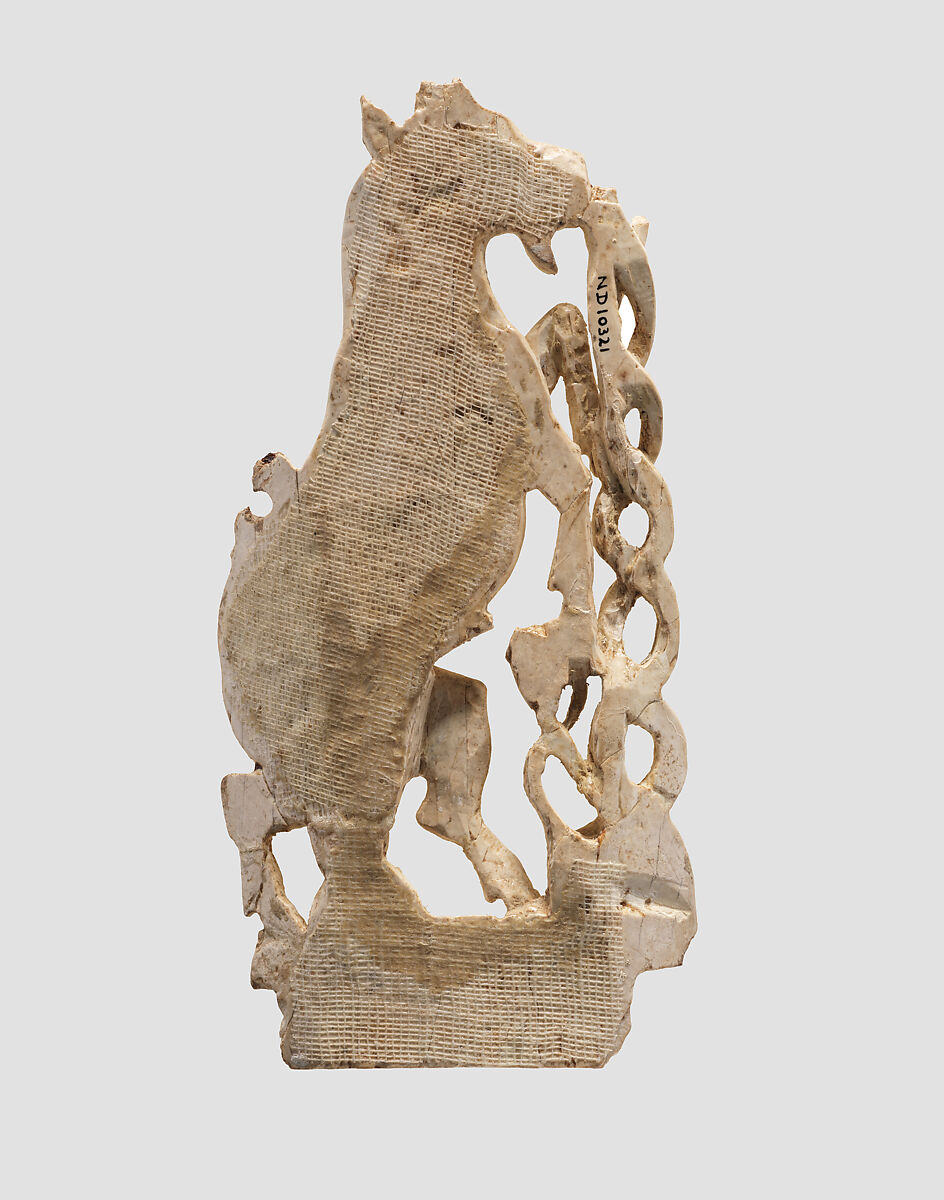 Openwork furniture plaque with a rearing goat, Ivory, Assyrian