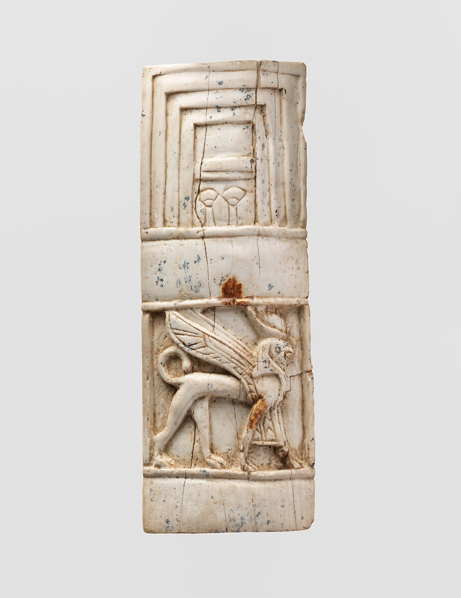 Furniture plaque carved in relief with window and sphinx, Ivory, Assyrian 