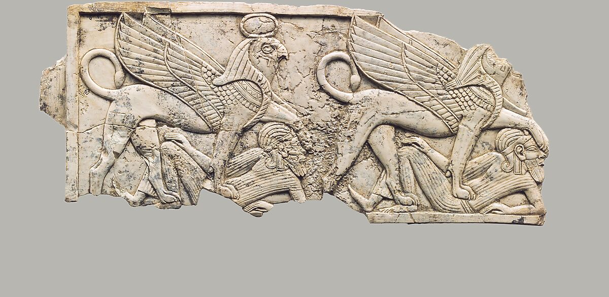 Furniture plaque carved in relief with two falcon-headed sphinxes trampling captives, Ivory, Assyrian