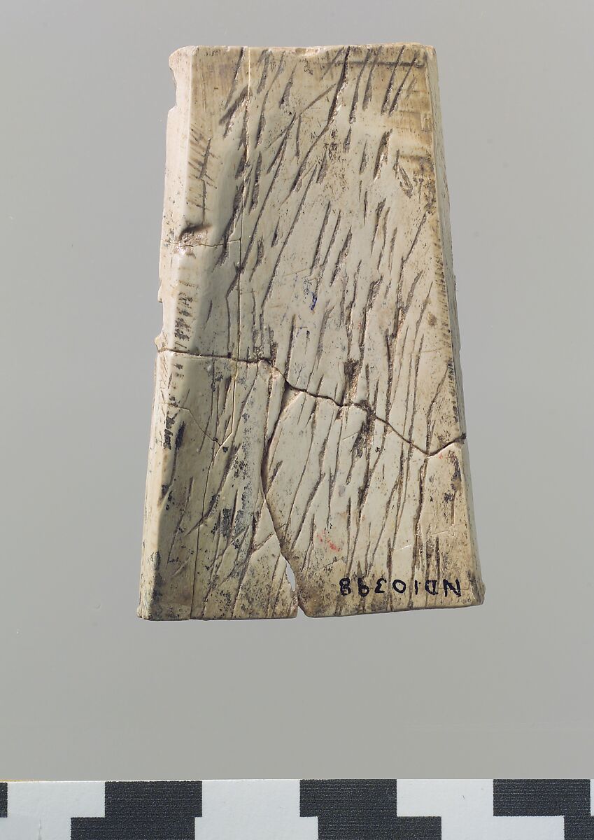 Champlevé furniture or cosmetic box plaque with a winged youth, Ivory, Assyrian