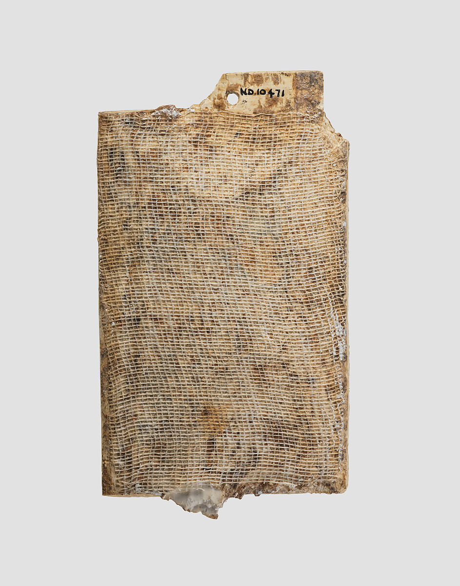 Furniture plaque carved in relief with a male figure slaying a griffin, Ivory, Assyrian