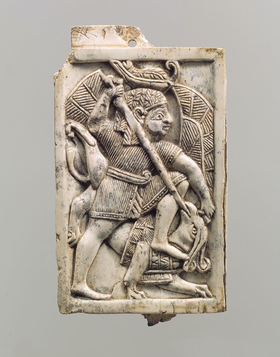 Furniture plaque carved in relief with a male figure slaying a griffin, Ivory, Assyrian