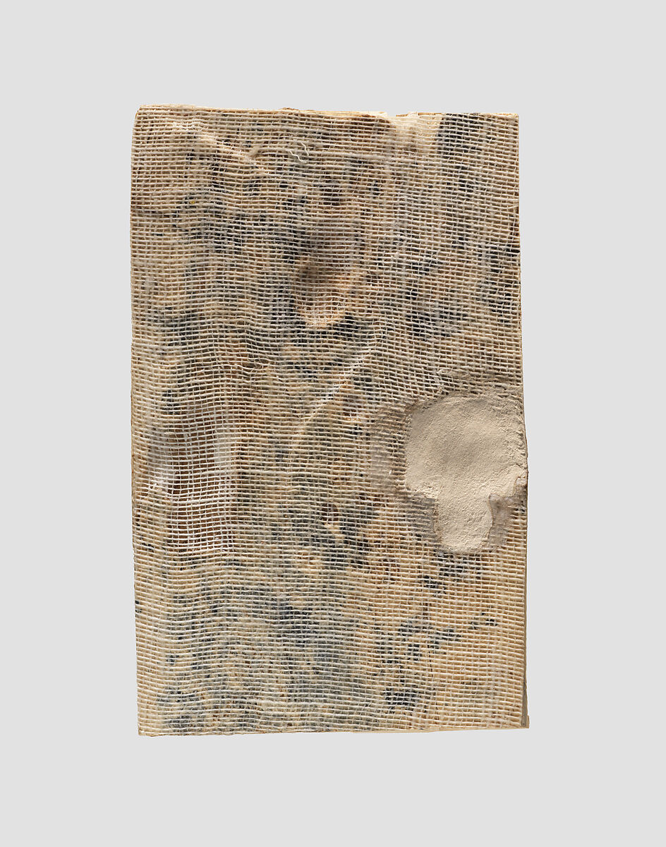 Furniture plaque carved in high relief with two Egyptianizing figures flanking a volute tree, Ivory, Assyrian