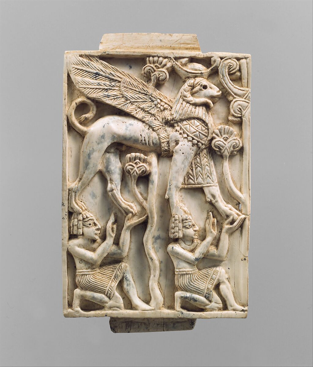 Furniture plaque carved in relief with a striding, ram-headed sphinx supported by two kneeling figures, Ivory, Assyrian 