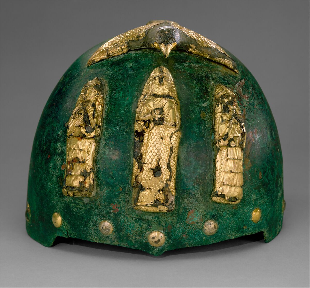Helmet with divine figures beneath a bird with outstretched wings, Bronze, gold foil over bitumen, Elamite 