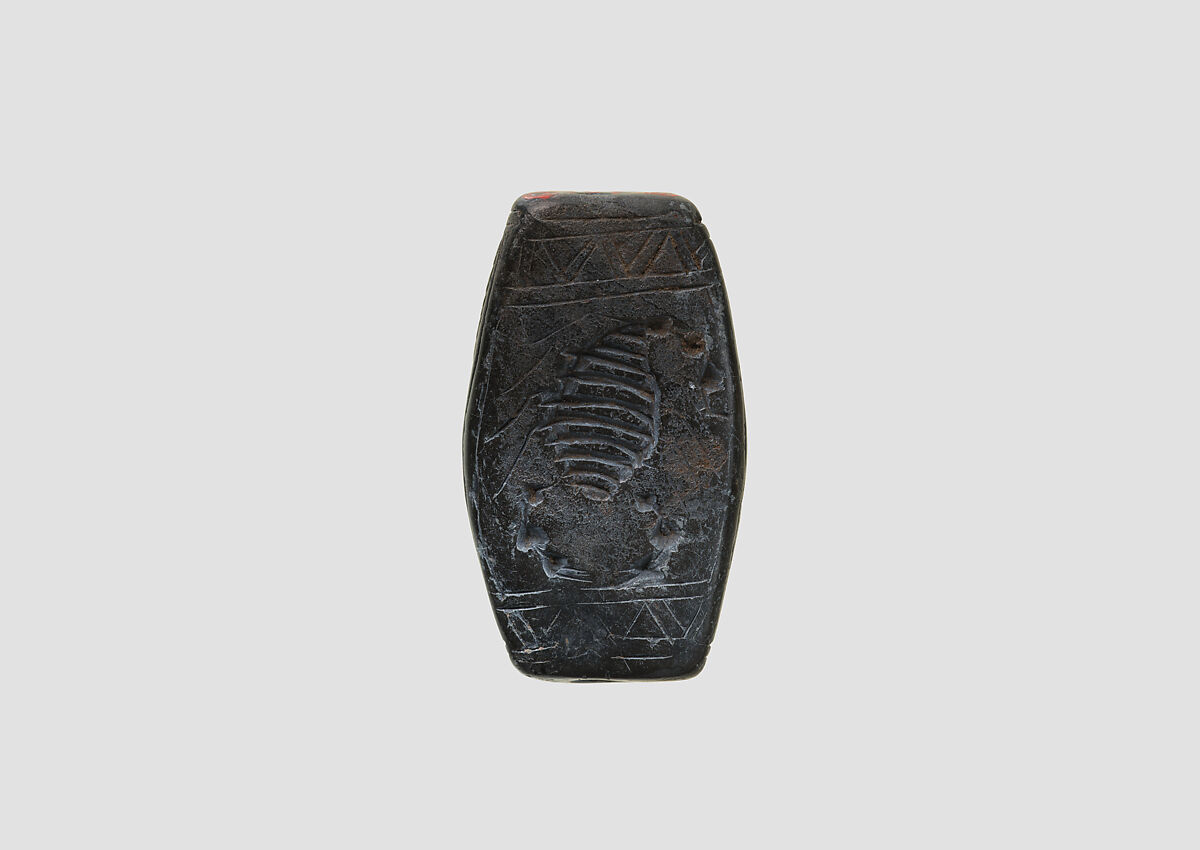 Stamp seal (loaf-shaped hemispheroid) with animal and symbol, Mottled gray Limestone, Assyrian