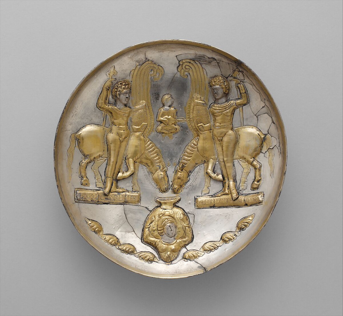 Plate with youths and winged horses, Silver, mercury gilding, Sasanian