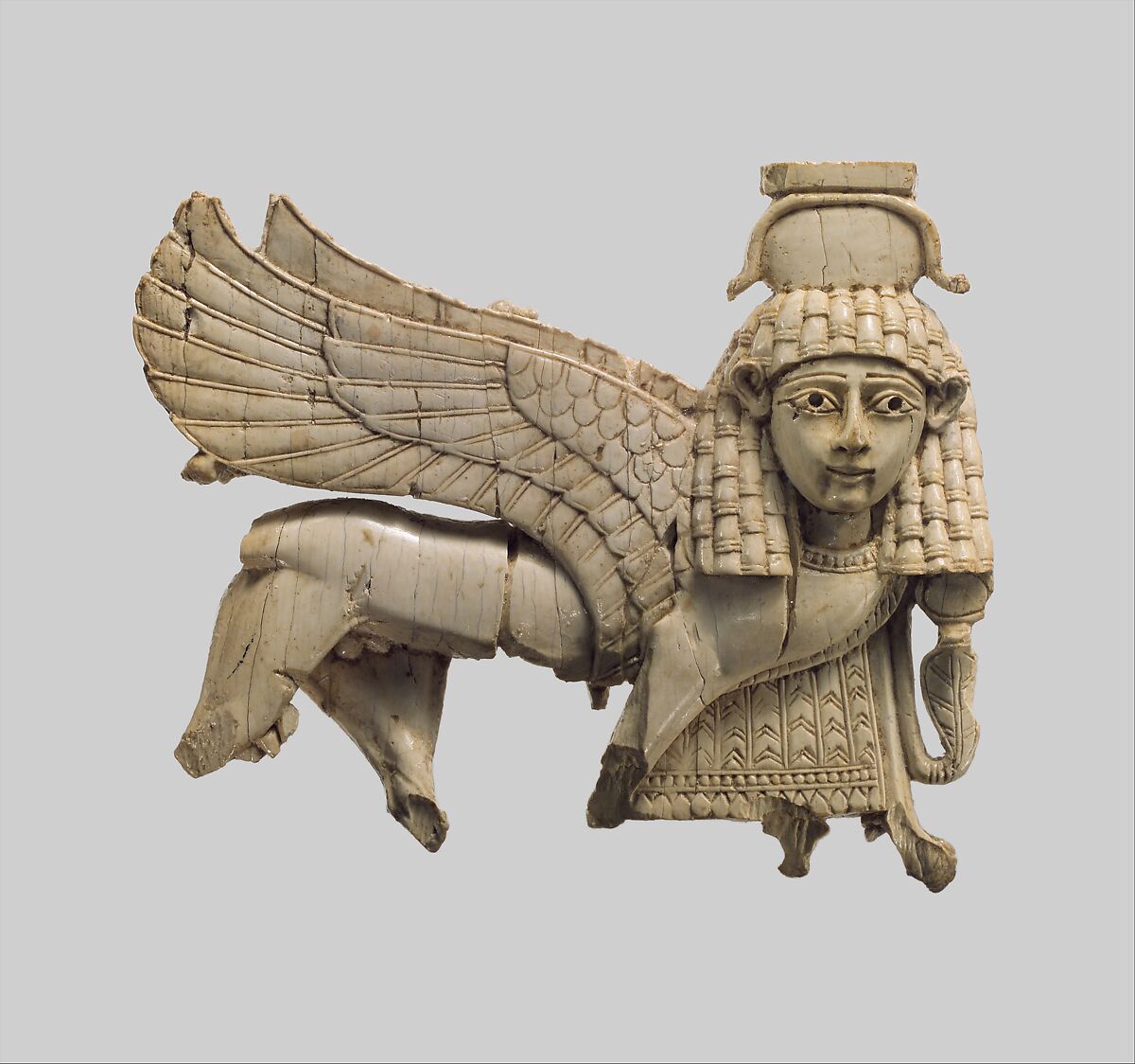 Openwork plaque with a striding sphinx, Ivory, Assyrian 