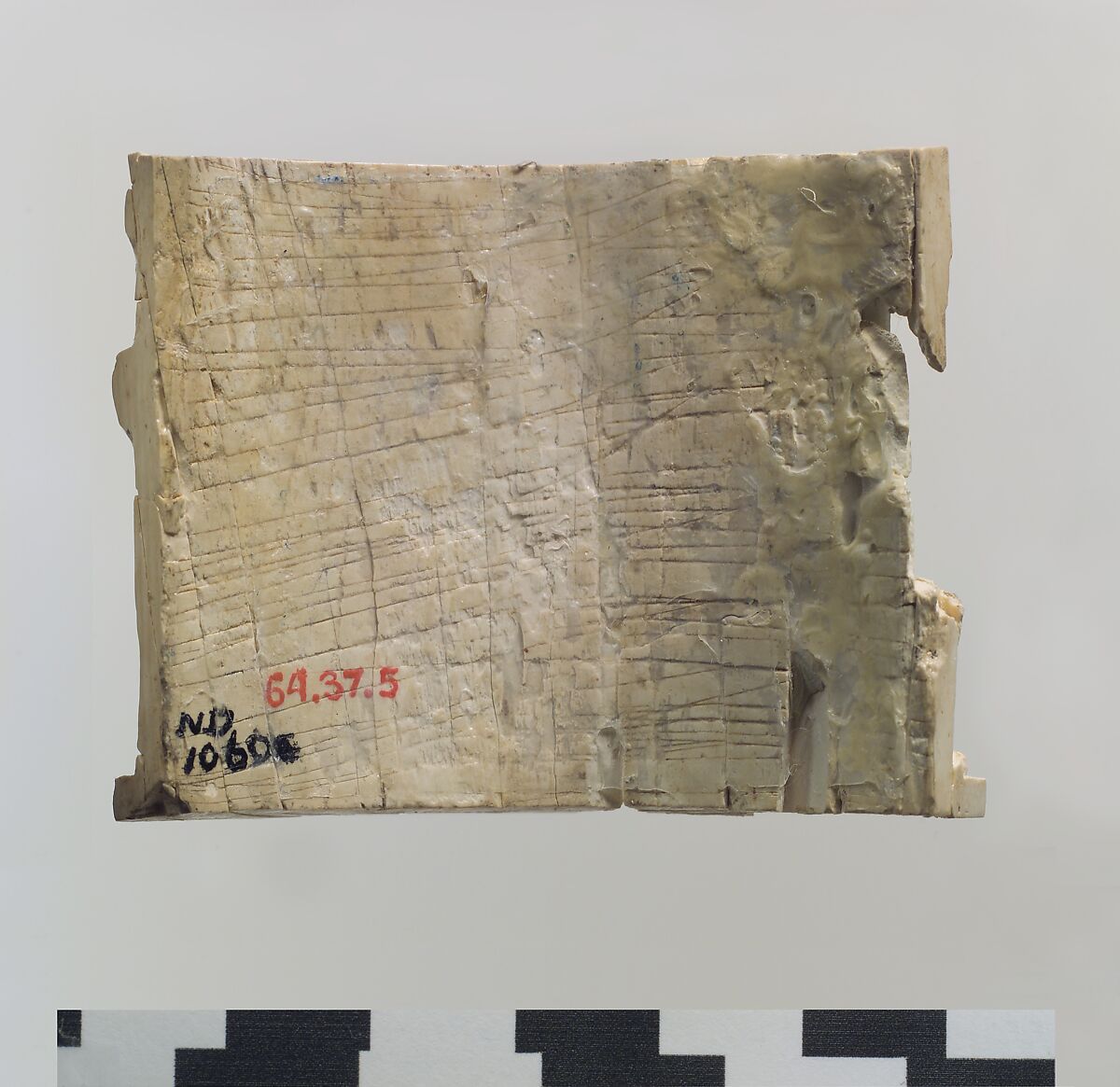 Furniture or cosmetic box plaque carved in relief with a striding bull, Ivory, Assyrian