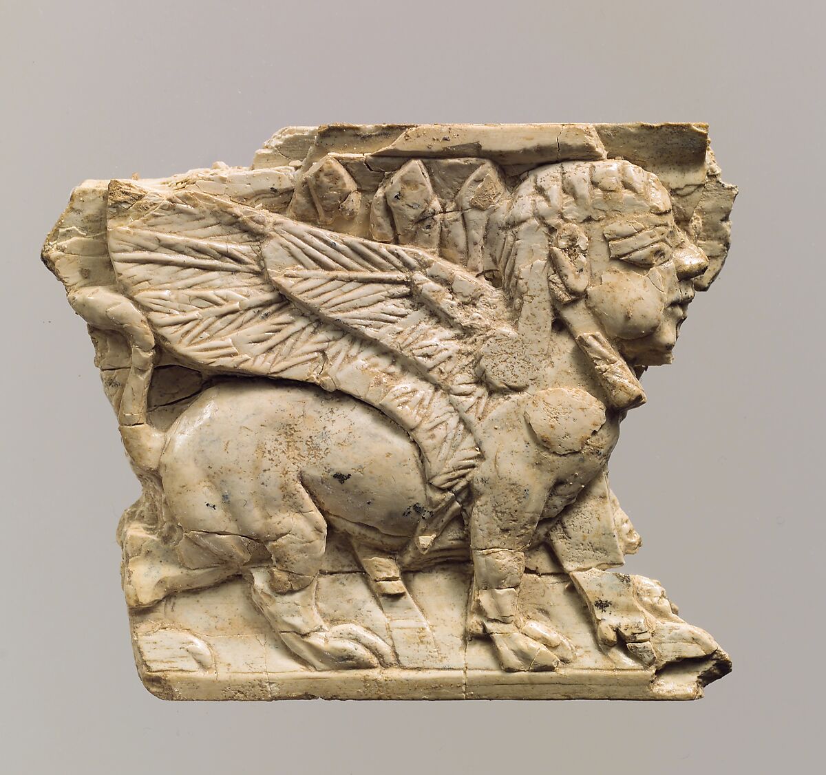 Furniture plaque carved in relief with sphinx, Ivory, Assyrian 