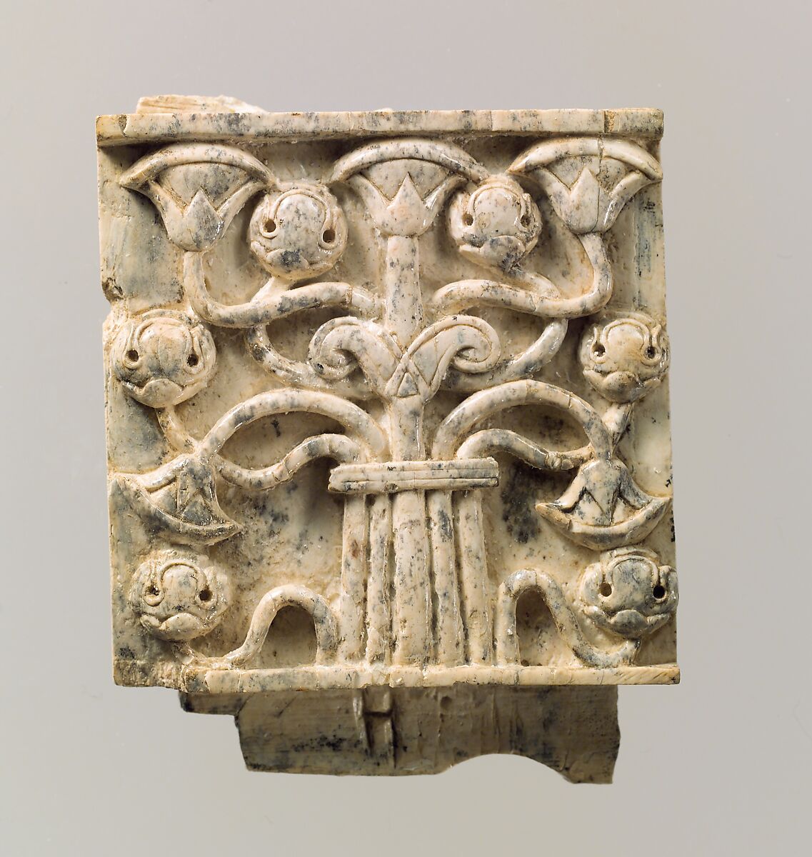 Furniture plaque carved in relief with stylized tree, Ivory, Assyrian 