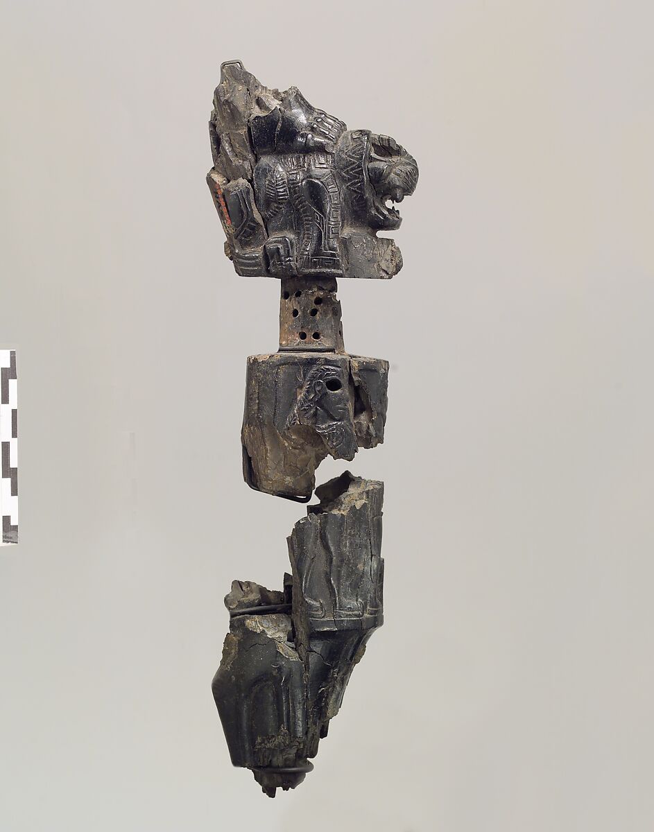 Furniture leg (?) with a recumbent lion supporting a deity, Ivory, Iran