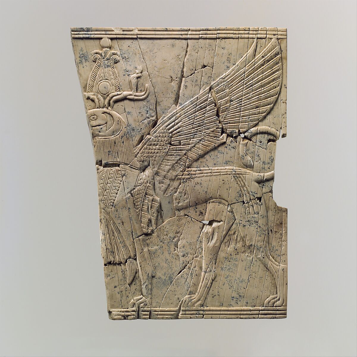 Furniture plaque carved in relief with a winged, falcon-headed sphinx, Ivory, Assyrian