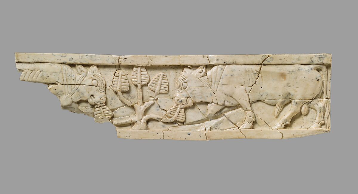 Furniture plaque carved in relief with bulls and tree, Ivory, Assyrian 