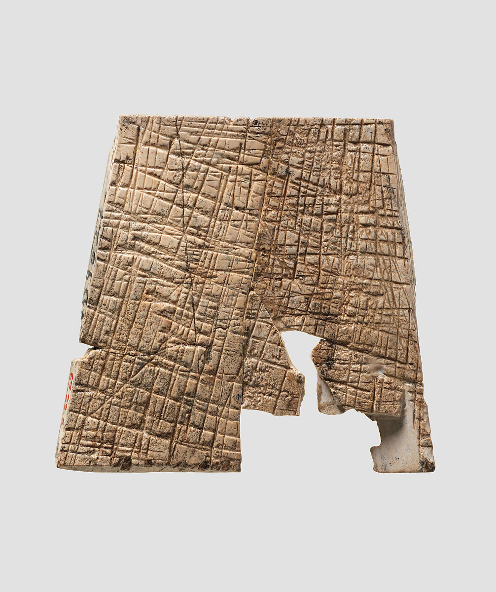 Plaque carved in relief with figure fighting a lion, Ivory, Assyrian