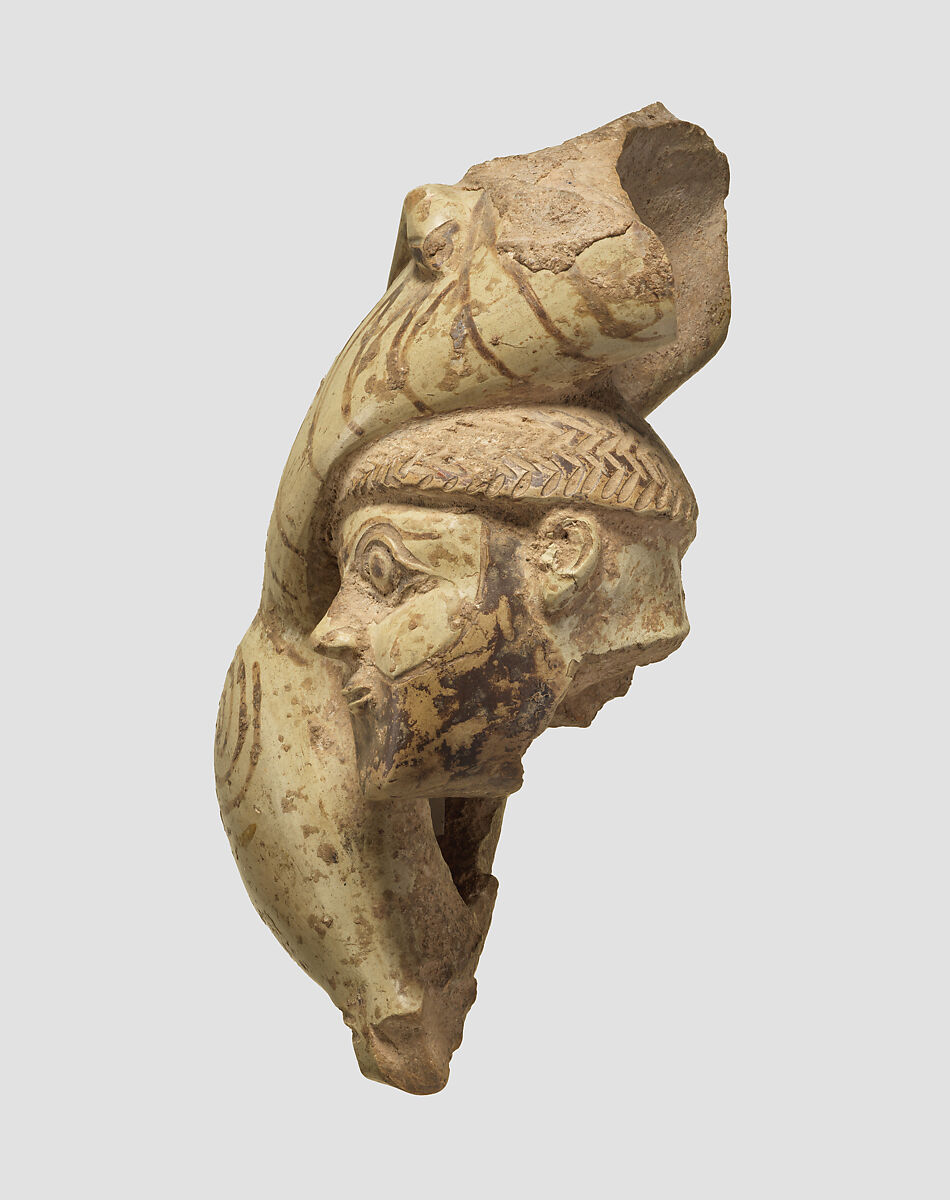 Fragmentary figure of a man and a lion in combat, Ceramic, paint, Iran