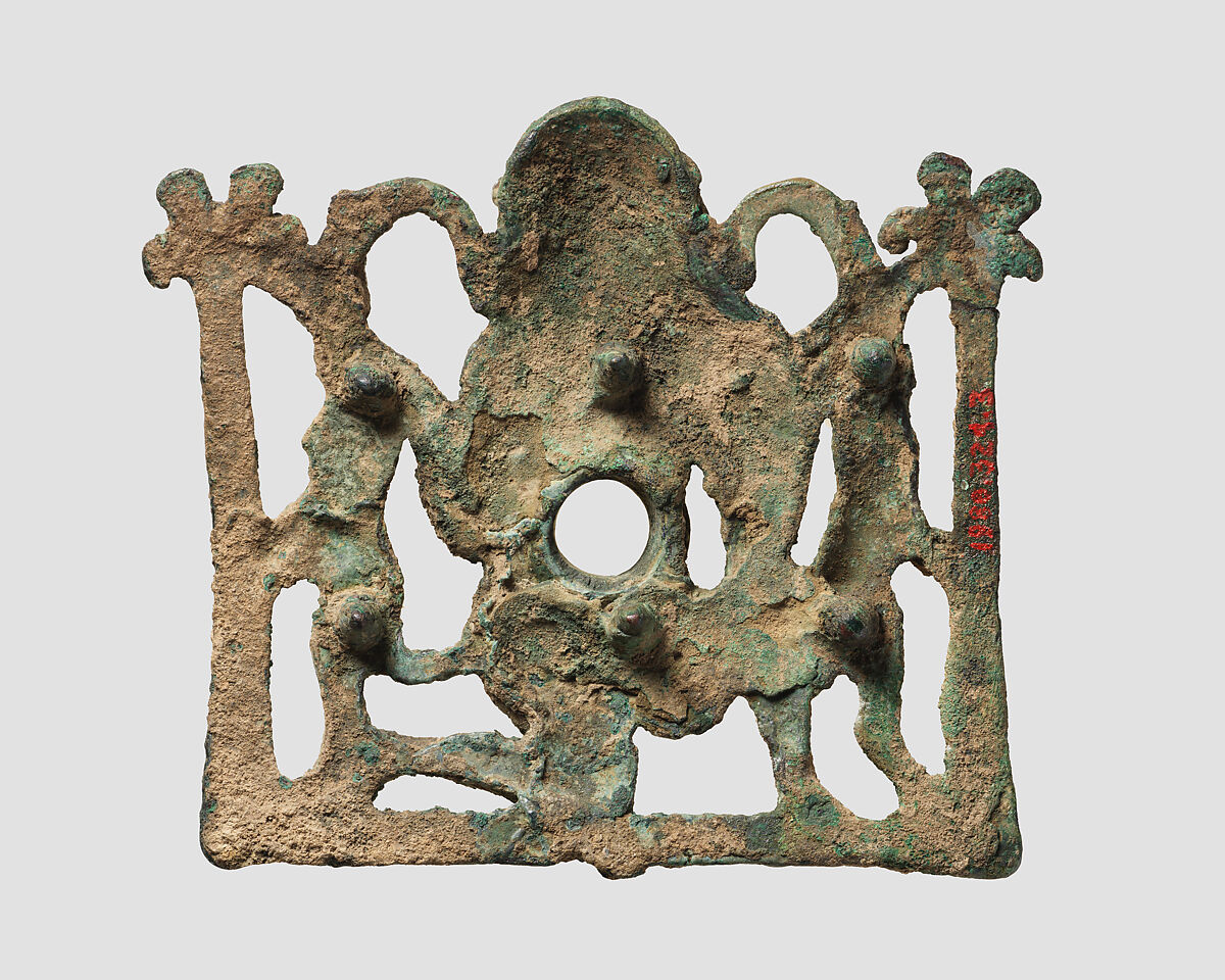 Horse bit cheekpiece in form of a kneeling hero, Bronze, Iran