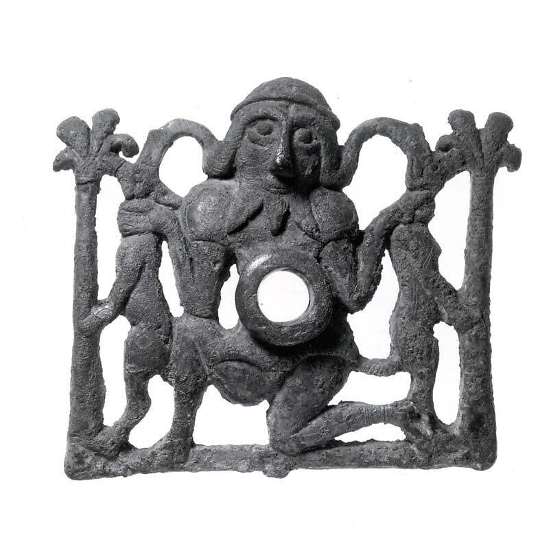 Horse bit cheekpiece in form of a kneeling hero, Bronze, Iran