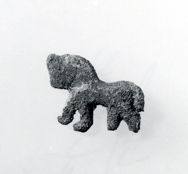Plaque in the form of a striding lion, Silver
