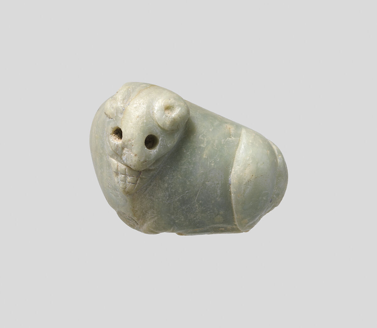 Seal amulet in the form of a reclining cow, Alabaster