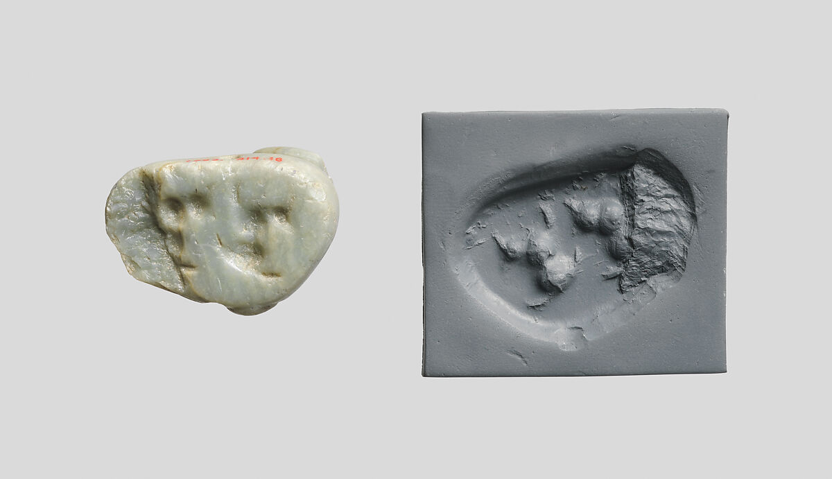 Seal amulet in the form of a reclining cow, Alabaster
