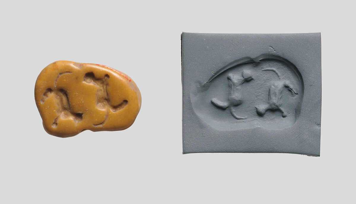 Seal amulet in the form of a recumbent fox, Marble, mustard color