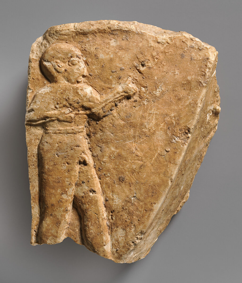 Fragment of a trough with a nude male figure in relief, Gypsum alabaster 