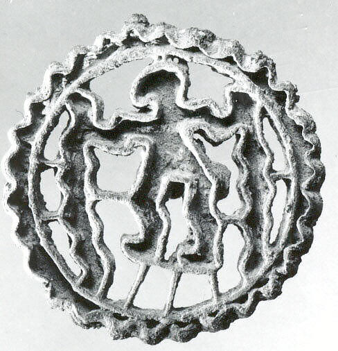 Openwork stamp seal: figure holding snakes, Copper alloy, Bactria-Margiana Archaeological Complex 