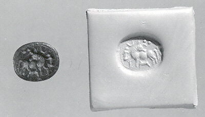 Stamp seal (scaraboid) with animal husbandry scene, Black Limestone, Syro-Levantine 