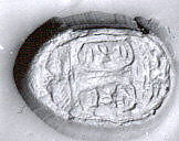 Stamp seal (ovoid, in grooved mount with loop handle) with cartouches, Steatite, white; copper alloy mount, Phoenician 