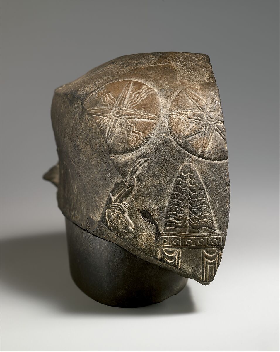 Top fragment of a kudurru with a mushhushshu dragon and divine symbols, Limestone