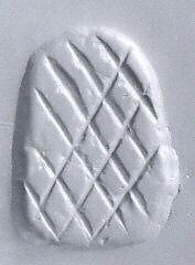 Loop-handled wedge-shaped stamping device, Chlorite or steatite, black 