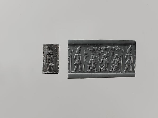 Cylinder seal and modern impression: pharaoh wearing Double Crown, kneeling figures below vultures holding shn symbols; ankh