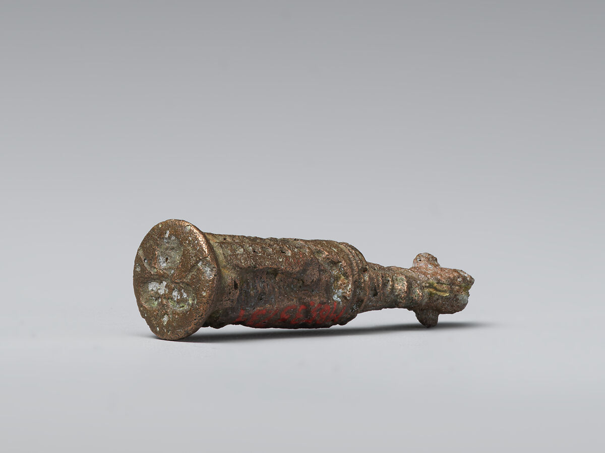 Stamp-cylinder seal with cultic scene, surmounted by (a plaster copy?) double-faced Pazuzu head, Copper/bronze alloy, plaster, Urartian