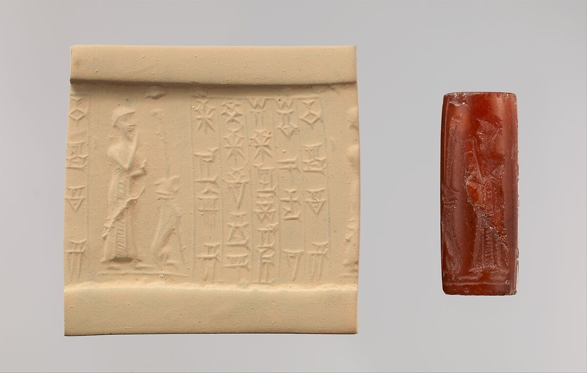 Cylinder seal and modern impression: male worshiper, dog surmounted by a standard, Carnelian, Kassite