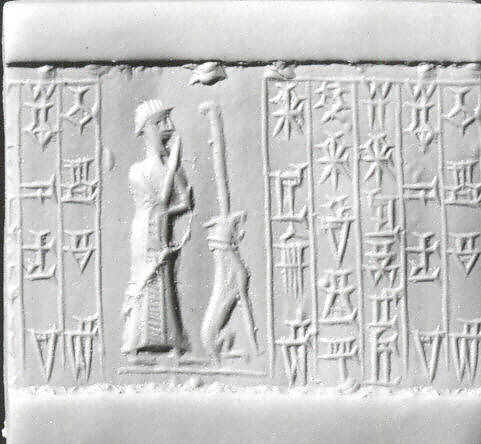 Cylinder seal and modern impression: male worshiper, dog surmounted by a standard, Carnelian, Kassite