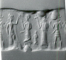 Cylinder seal and modern impression: partially nude and robed goddesses raising ankh symbols over a king; weather god