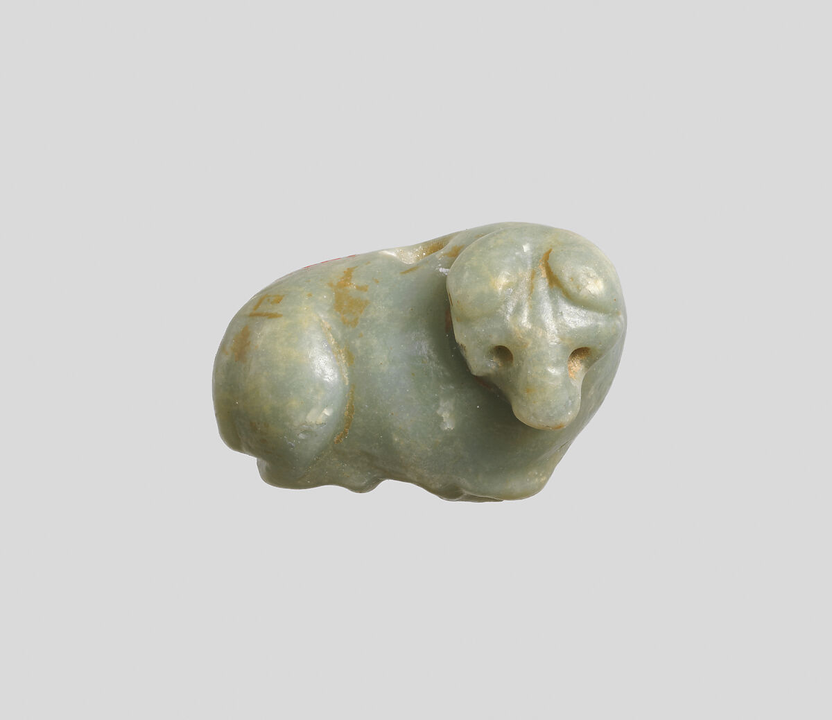 Seal amulet in the form of a recumbent bovid, Calcite, green 