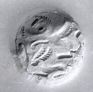 Bell-shaped seal with perforated fist-shaped handle, Ceramic, green, Achaemenid 